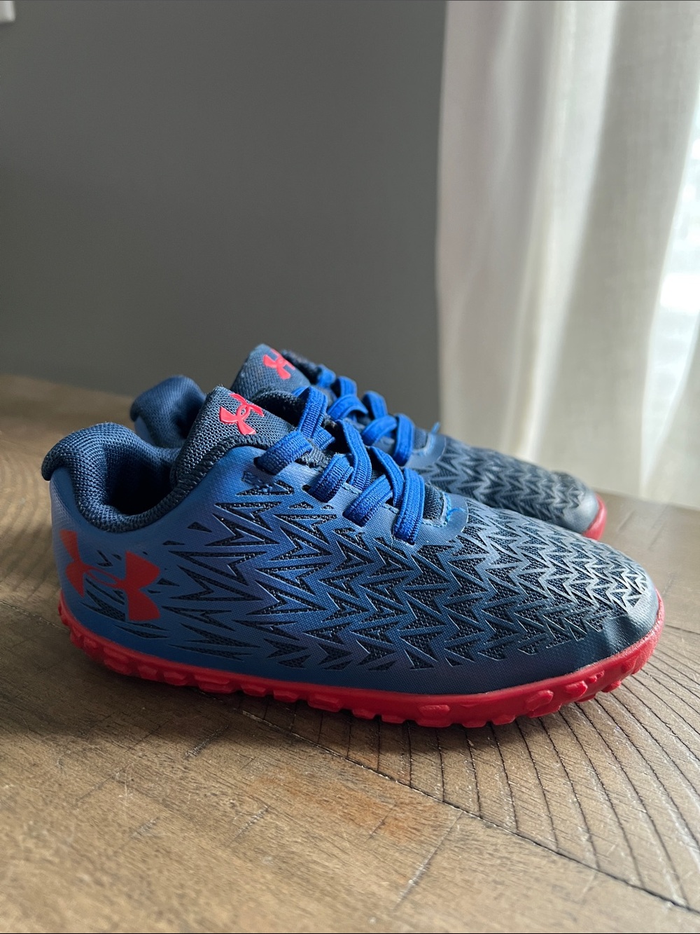 Under Armour Kids Navy Blue Sneakers with red Soles
